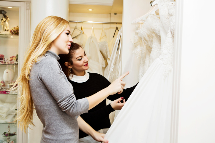 Beautiful young woman in bridal boutique