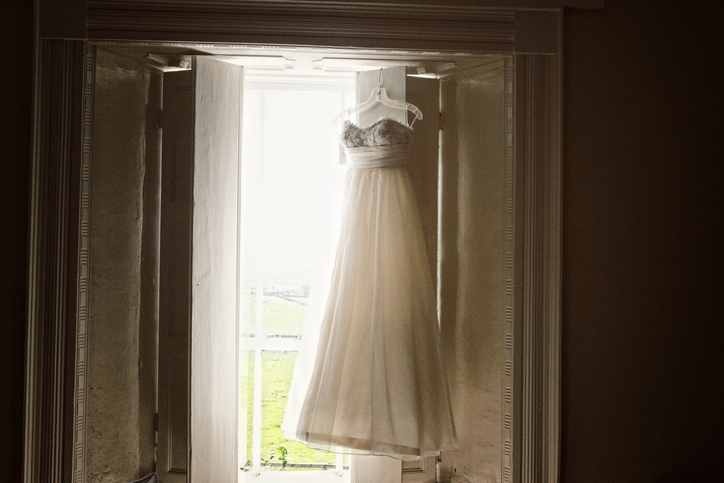 wedding dress hung up 