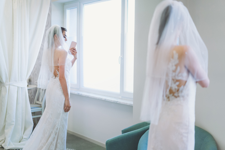 taking photo in wedding dress